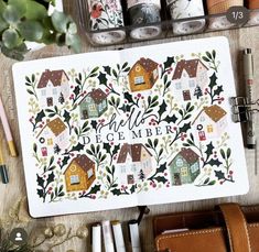 a notebook with the words hello december written on it and various crafting supplies next to it