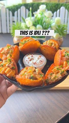 a person holding a plate with some food on it and the words this is dl?