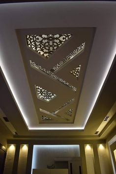 the ceiling is decorated with modern designs and lights