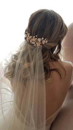 the back of a bride's head wearing a veil