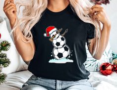 Celebrate Christmas with Your Soccer Snowman Shirt!  🎅 Show off your love for soccer with our 'Soccer Snowman Shirt.'  🎄 Featuring a cute design of a snowman made out of a soccer ball, it's perfect for a soccer festive shirt and football Christmas.  🎁 This shirt adds a fun and festive touch to your soccer lover apparel.  ❄️ Ideal for the holiday season, this shirt is a must-have for Christmas.  🎄 Add a cool and cozy shirt to your wardrobe with this soft and adorable Christmas tee.  🎅 Makes a great gift for anyone who loves soccer and football.  🎁 Whether you're playing soccer or enjoying the holidays, this awesome tee is perfect for Christmas.  Celebrate Christmas with joy in our 'Soccer Snowman Shirt'! 🌈 Shirt Colors: Check out the image to see our full range of available shirt col Football Christmas, Snowman Shirt, Playing Soccer, Festival Shirts, Xmas Shirts, Play Soccer, Soccer Player, Celebrate Christmas, Soccer Football