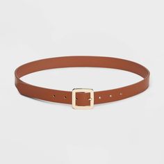 Instantly enhance any of your looks with this Chunky Center Bar Buckle Belt from A New Day™. This neutral tan belt offers easy styling with a range of outfits. It features a chunky square-shaped buckle closure for a touch of shine and chic style. This stylish women's belt with multiple holes provides an adjustable, secure fit around your waist. Whether paired with formal trousers or wrapped around the waist of a dress, this center bar belt lends on-trend flair to any outfit. A New Day™: Style th Trendy Brown Belt For Workwear, Casual Belts For Workwear In Spring, Casual Belts For Spring Workwear, Casual Spring Belts For Workwear, Trendy Brown Belts With Buckle Closure, Trendy Brown Belt With Buckle Closure, Casual Brown Belt For Workwear, Casual Brown Belt For Work, Casual Brown Belt With Buckle Closure