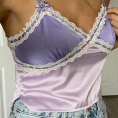 Urban Outfitters Satin Tank Top Cami Straps Adjustable With Cute Purple Roses At Bases (Y2k) Color Is Lilac Dark Purple On Top Lace Details With Purple Ribbon Weaved In And Out Base Is A Darker Shade Of Purple Cropped With 2 Side Slits Size Med Measurements Approx- 16” Pit To Pit Laying Flat 16-18.5” Long If Straps Are Extended Brand New With Tags Fitted Purple Top With Lace Trim, Fitted Purple Camisole For Spring, Fitted Camisole Tops By Urban Outfitters, Urban Outfitters Fitted Camisole Top, Fitted Lavender Camisole Top, Urban Outfitters Tops With Lace Trim For Spring, Fitted Purple Cotton Camisole, Fitted Lavender Camisole, Satin Tank Top