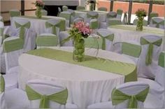 the tables are covered with green and white linens