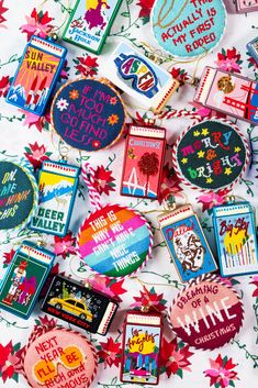 many decorated cookies are laying on the table