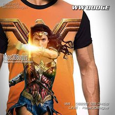 the man is wearing a t - shirt with wonder woman on it