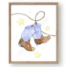 a watercolor painting of a pair of cowboy boots hanging on a string with stars