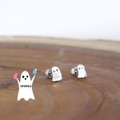 These little ghosty earrings are perfect for Halloween! 👻 Congratulations, Ghost Hunter! You've successfully uncovered the hidden specter on our website, and your reward is 20% off your next purchase! Use code SPOOKY23 at checkout to claim your well-earned discount. But beware, as the ghostly magic fades with the dawn after All Hallows Eve, so make sure to put this enchanting code to use before then. Happy shopping, and may your Halloween be filled with spooky delights! 🎃🌕 .925 Sterling Silve Spooky Nickel-free Silver Earrings, Spooky Silver Nickel-free Earrings, Spooky Silver Pierced Earrings, Spooky Silver Earrings For Gift, Handmade Sterling Silver Halloween Earrings, Spooky Nickel-free Jewelry For Gifts, Spooky Nickel-free Jewelry Gift, Silver Earrings For Halloween Gift, Ghost Hunter