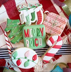 decorated christmas cookies sitting on top of a table