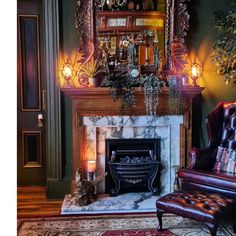 a living room with a fireplace, chair and mirror