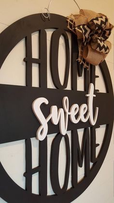 a metal sign that says home sweet home