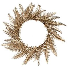 a wreath made out of gold leaves on a white background