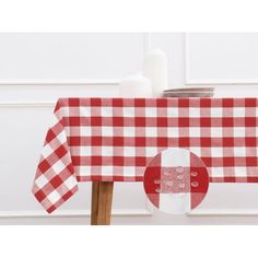 a red and white checkered table cloth on a wooden chair