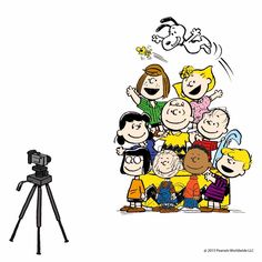 a tripod is next to a drawing of cartoon characters on a white background and an image of a group of people