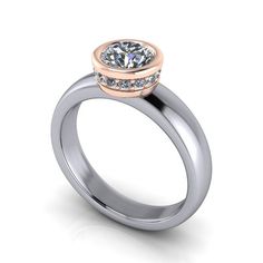 a diamond ring with two tone gold and white diamonds on the side, set in 18k rose gold