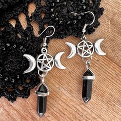 Triple moon phase pentagram earrings with small black glass  or clear crystal dangles. These gothic earrings hang down 2 1/2" but are not too heavy with this small size crystal. You can choose black glass or clear quartz crystal stones.  Or you can get just the moon phase pendants as earrings. Your new favorite pair of earrings or a great gift! The earrings hang on a silver surgical steel ear wire. Your earrings will come carded in an organza bag, bubble wrapped for safe travel.  For more earrin Witchy Black Dangle Jewelry, Black Witchy Dangle Jewelry, Black Metal Witchy Earrings, Spiritual Moon Phase Dangle Earrings, Gothic Dangle Metal Plug Earrings, Gothic Gifts, Gothic Earrings, Triple Moon, Clear Quartz Crystal