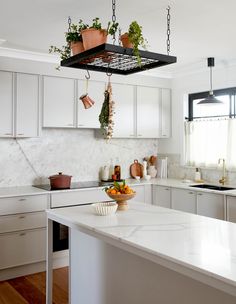 a kitchen filled with lots of white counter top space