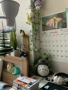 a desktop computer sitting on top of a desk next to a calendar and other items