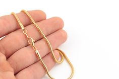 "24k Gold Plated Snake Necklace Chain, Bar Necklace Chain, Finished Chain, Gold Plated Soldered Chain Description Material:Brass Chain Lenght : 15''-16\"-17\"-18\"-20\"-22-\"25\"inç Chain Size:2.30mm Color:24k Gold Plated Quantity:Options Click on the link below to see our other chain models. https://www.etsy.com/shop/Hellojewelrysupplier?ref=seller-platform-mcnav&section_id=43126577 To return to the homepage https://www.etsy.com/shop/Hellojewelrysupplier?ref=seller-platform-mcnav" Gold Snake Shape Chain Necklace Gift, Snake Shape Gold Chain Necklace Gift, Gold Plated Snake Chain Necklace Gift, Gold Chain Necklace 16 Inch, Gold Plated Adjustable Snake Chain Necklace Gift, Gold Pendant Chain Necklace 16 Inch, Gold Chain Necklace 16 Inch As Gift, Gold Plated Snake Chain Necklace For Jewelry Making, Gold Snake Chain Necklace 16 Inch