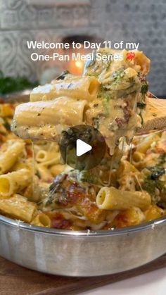 a pan filled with pasta and broccoli covered in cheese