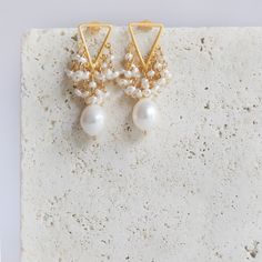 We thought we'd make fringe even better by adding pearls. - Beautiful white freshwater pearls- 1.25" long- Post backs- 14k gold plated .925 fine Italian sterling silver- Made in the USA in our NYC studio- Packaged in a gift box- Free shipping on US orders Handmade to last. Our unique gold plating technique makes our jewelry tarnish resistant. The nature of natural gemstones makes each style one-of-a-kind. Gold Plated Pearl Drop Chandelier Earrings, Gold-plated Chandelier Earrings With Pearl Drop, White Pearl Chain Gold-plated Earrings, White Gold Plated Chandelier Earrings With Pearl Drop, White Gold-plated Chandelier Earrings With Pearl Drop, White Gold Plated Earrings With Pearl Chain, White Gold Plated Pearl Chain Earrings, White Gold Plated Dangle Pearl Earrings, White Gold Plated Chandelier Earrings As Gift