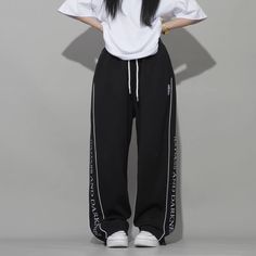 Stay comfortable and stylish when out and about in these premium Women's Street Mask Embroidered Sweatpants. Crafted with a drawstring waist and two side pockets, these soft and lightweight sweatpants offer superior comfort and convenience. An embroidered Street Mask detail gives the design a unique finish. Features: -100% Polyester -Mid-rise Waist -Drawstring Waistband -Letter Embroidery -Mask Graphic -Solid color -Straight Leg -Regular Fit Black Drawstring Sportswear Pants, Sportswear Sweatpants With Drawstring For Streetwear, Trendy Sweatpants With Drawstring For Streetwear, Trendy Drawstring Sweatpants For Streetwear, Leisure Wide-leg Sweatpants With Drawstring, Black Drawstring Pants For Jogging, Black Drawstring Jogging Pants, Black Straight Leg Sweatpants With Letter Print, Straight Sweatpants With Drawstring For Leisure