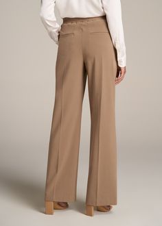 About Our Flat Front Wide Leg Dress Pants for Tall Women Ultra-flattering and easy to wear, these women's tall dress pants are a closet essential. They feature a smooth front with a contoured waistband for a complimentary finish. Pleated accents at the front and back elongate your legs and make them easy to wear from the desk to dinner. Built with a stretch-infused polyester-viscose blend, these pants for tall women offer the sleek feel of a suit with the comfort of a lounge pant. An elastic at Elegant Ankle-length Dress Pants With 4-way Stretch, Elegant Ankle-length 4-way Stretch Dress Pants, Elegant 4-way Stretch Ankle-length Dress Pants, Fall Business Casual Elastane Dress Pants, Formal Wide Leg 4-way Stretch Dress Pants, Formal Wide Leg Dress Pants With 4-way Stretch, Formal Wide-leg Dress Pants With 4-way Stretch, 4-way Stretch Dress Pants For Spring Workwear, Fall Full Length Dress Pants For Work