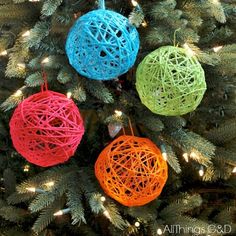 colorful ornaments are hanging on the christmas tree