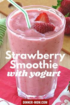 strawberry smoothie with yogurt in a glass on a table next to strawberries