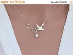 ON SALE Silver Infinity Bird Necklace, Friendship Necklace, Mother Necklace, Mother of the Bride or Groom Jewelry, Wedding Gift, Jewelry Car by rainbowearring on Etsy https://www.etsy.com/listing/179012659/on-sale-silver-infinity-bird-necklace White Infinity Jewelry For Mother's Day, White Infinity Jewelry For Gifts, White Infinity Jewelry Gift, White Infinity-shaped Jewelry Gift, Groom Jewelry, Necklace Friendship, Mother Necklace, Friendship Necklace, Friendship Necklaces