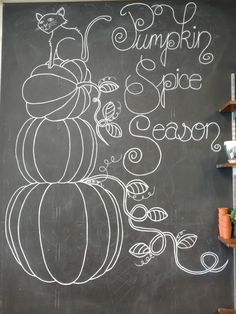 a chalkboard with pumpkins and the words pumpkin spice heaven written on it's side