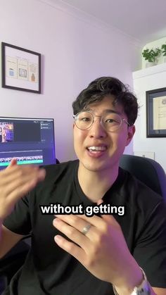 a man sitting in front of a computer screen with the words without getting on it