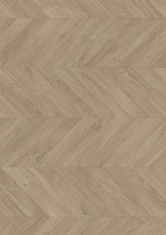 an image of wood flooring that looks like chevroned herringbones in light brown