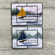 two cards with sailboats on them, one is blue and the other is yellow