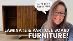 a woman with long hair and glasses sitting in front of a cabinet that says laminate & article board furniture