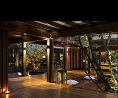 the inside of a house with wood flooring and lights on it's sides