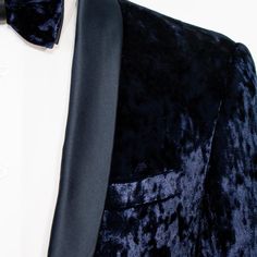 This tuxedo's supple crushed velvet fabric and uniquely styled jacket closure creates a suave, head-turning look that's an exquisite fusion of modern and classic looks. Shawl lapels and subtle satin detailing round out its handsome, slim-fit design. Pairs well with flashier loafers or dress shoes. Men's 3-Piece Velvet Tuxedo 65% Viscose, 35% Polyester Fabric Slim-Fit Satin Shawl Lapel Matching Jacket, Vest and Pants Single-Breasted, One-Button Jacket Single-Breasted, Four-Button Vest Frog Jacket Luxury Navy Tuxedo, Luxury Navy Tuxedo In Suiting Fabric, Velvet Navy Tuxedo, Frog Jacket, Luxury Velvet Semi-formal Tuxedo, Navy Velvet Fabric Swatch, Frog Closure, Satin Shawl, Velvet Tuxedo