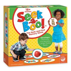 a child playing with seek and boo memory game in front of a box on the floor