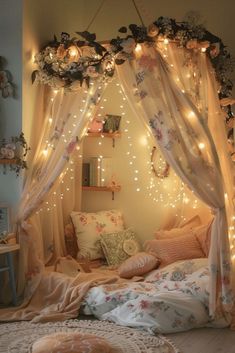 a canopy bed with fairy lights hanging from it