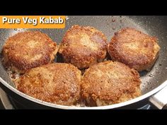 four fried meat patties in a pan on the stove with words pure veg kabab