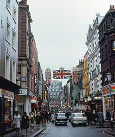 a busy city street with cars and pedestrians