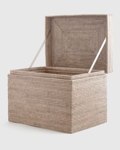 an empty wicker box sitting on top of a table