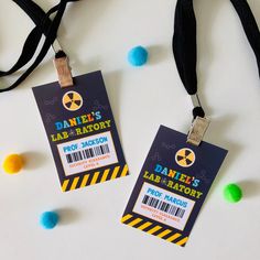 two tags that are attached to a lanyard