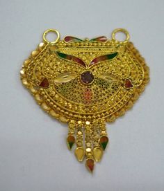 vintage 20kt gold pendant necklace from rajasthan india. great handmade design, good for jewelry collection.height max - 4.5 cm(1.77")width max. - 3.7 cm(1.45")weight - 5.4 gramsmaterial - 20kt solid yellow gold.RJ Traditional Gold-plated Kundan Pendant Necklace, Traditional Gold Plated Kundan Pendant Necklace, 22k Gold Kundan Pendant Necklace For Diwali, 22k Gold Temple Necklace Pendant For Festivals, Gold Kundan Pendant Temple Necklace, Traditional Yellow Gold Temple Necklace With Pendant, Ornate 22k Yellow Gold Kundan Necklace, Ornate Kundan Necklace In 22k Yellow Gold, 22k Gold Pendant Temple Necklace For Festivals