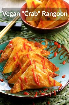 some food on a plate with chopsticks next to it and the words vegan crab rangon