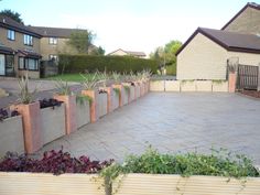 an empty backyard with several planters in it