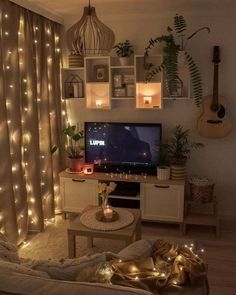 a living room with lights on the walls and a flat screen tv in the corner