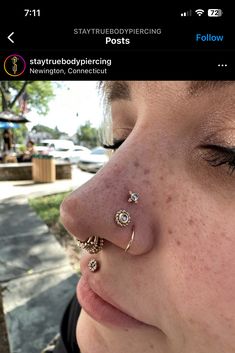 a close up of a person with a nose piercing on their left side of the nose