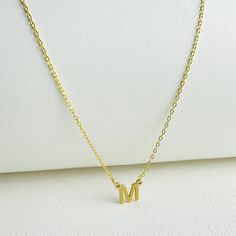 L E T T E R ∙ C H A R M ∙ N E C K L A C E  (MONOGRAM) * Base Material: High-Quality Solid 925 Sterling Silver. * Finish: Sterling Silver ∙ 18K Gold (A thick layer of gold plating) * Dimension: 7mm letter height *  All our necklaces are lovingly crafted by hand, and uniquely customized  ♡ H O W ∙ T O ∙ CUSTOMIZE  ∙  O R D E R 1) Select FINISH  2) Select LENGTH  3) Use the 'PERSONALIZATION BOX' to let us know the Initial you would like. (Example: M ) 4) Click "Add to Cart" 5) Proceed to Checkout 6) Complete order O T H E R ∙ I N F O R M A T I O N * The length option is the TOTAL chain length (including the charm). If you order an 18" chain, the piece will come as CHAIN + CHARM = 18". All pieces will come with a 2" extension chain. * All items have jewelry boxes. * 18K Gold provides tarnish r Minimalist Hypoallergenic Necklace For Mother's Day, Classic Gold Necklace For Mom's Gift, Classic Gold Necklace For Mom, Classic Hypoallergenic Necklace For Gift, Classic Hypoallergenic Necklaces For Gifts, Hypoallergenic Gold Initial Necklace Gift, Gold Hypoallergenic Initial Pendant Jewelry, Hypoallergenic Gold Initial Pendant Jewelry, Gold Hypoallergenic Necklace For Her