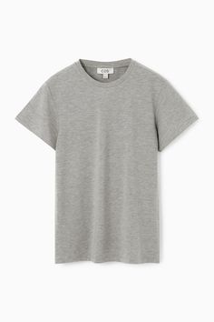 Channeling a '90s sensibility, this white T-shirt is cut in a shrunken, slim shape that contours the body. It's made from soft cotton-jersey blended with TENCEL™ Modal for lightness and is slightly shorter in length.  Slim fitTENCEL™ is a trademark of Lenzing AG. TENCEL™ Modal is made from sustainably sourced beech wood, a renewable raw material  Shell: 46% Cotton, 46% TENCEL™ Modal, 8% Elastane. Excluding trims / Machine wash Back length of size S is 22.95" / Model wears a size S Classic Fitted Cotton T-shirt, Classic Fitted Crew Neck T-shirt, Classic Fitted Gray T-shirt, Denim Sweater, Cardigan Shirt, Silk Print Dress, Vest Shirt, Home T Shirts, Raw Material